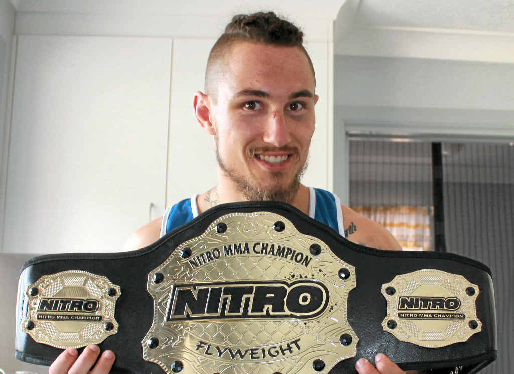 BELTING GOOD WIN: Luke Morris has become the first Coffs Harbour-based MMA fighter to win an Australian title. He won the Australian Nitro Flyweight title in Brisbane recently. BELTING GOOD WIN: Luke Morris has become the first Coffs Harbour-based MMA fighter to win an Australian title. He won the Australian Nitro Flyweight title in Brisbane recently.
